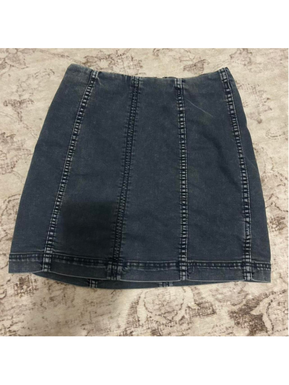 Free People black/grey denim mini skirt with zipper in a size 6
Message me with